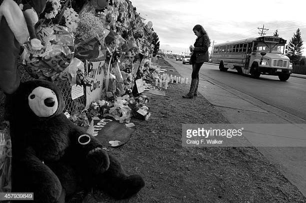 CENTENNIAL, CO. - DECEMBER 19: Junior Hailey Fulwider visits the tribute area before entering Arapahoe High School in Centennial, CO December 19, 2013. Seniors and Juniors returned to the school for two hour periods Thursday, Sophomores and Freshmen will return on Friday. The victim from Fridays shooting at Arapahoe High School, Claire Davis, 17, remains in critical condition. She was shot on Friday when classmate Karl Pierson opened fire in the school. The gunman died from a self-inflicted gunshot wound. (Photo By Craig F. Walker / The Denver Post)